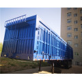 MK Blue box semi-trailer transporting cargo